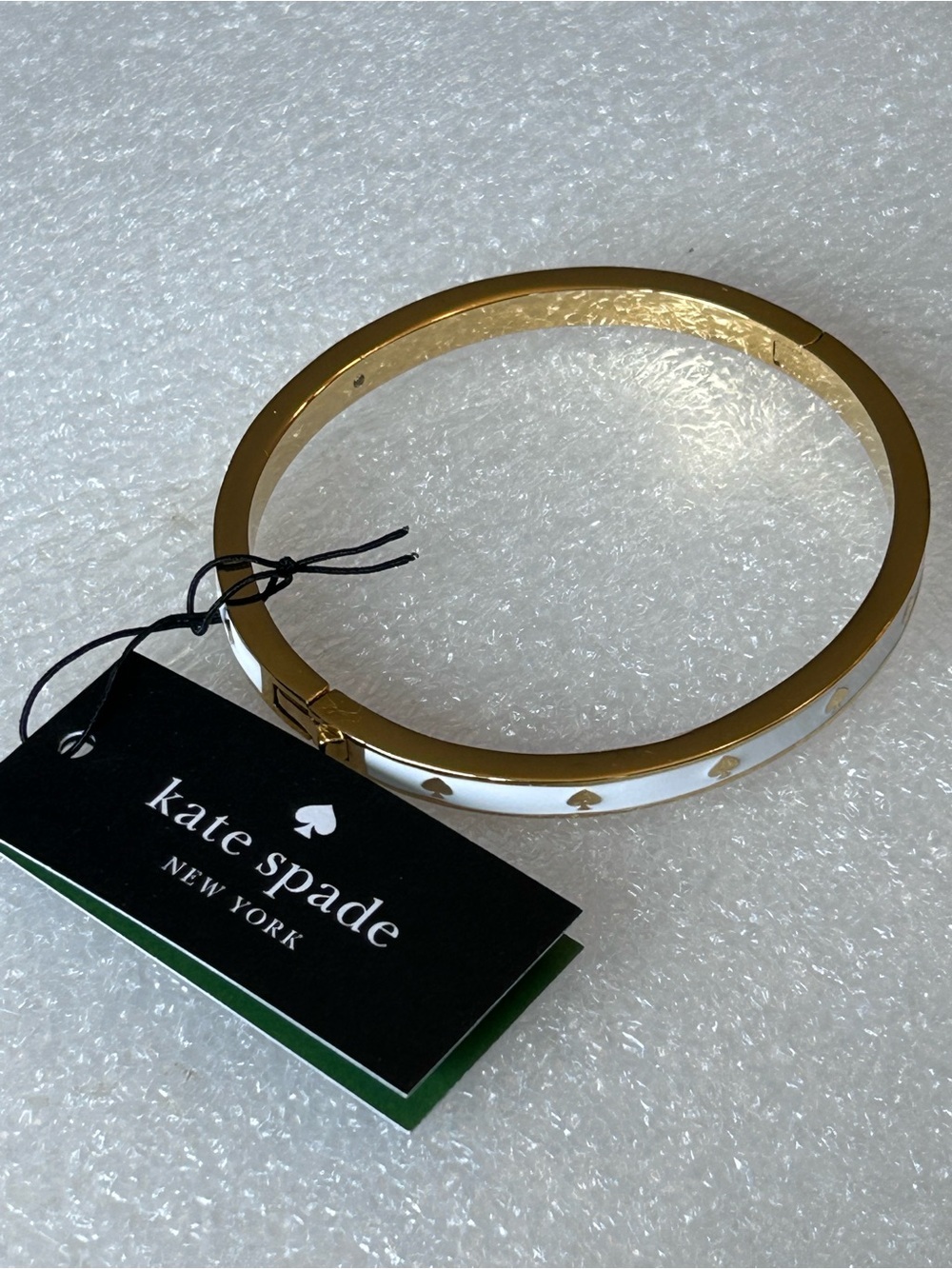 kate spade Gold and White Spade Enamel Accent Hinged Bangle Bracelet